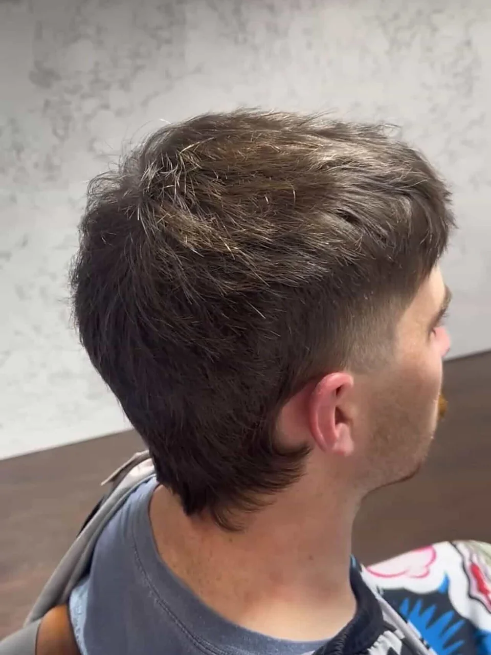 After: a modern mullet — textured through the top with a clean taper and a defined nape.