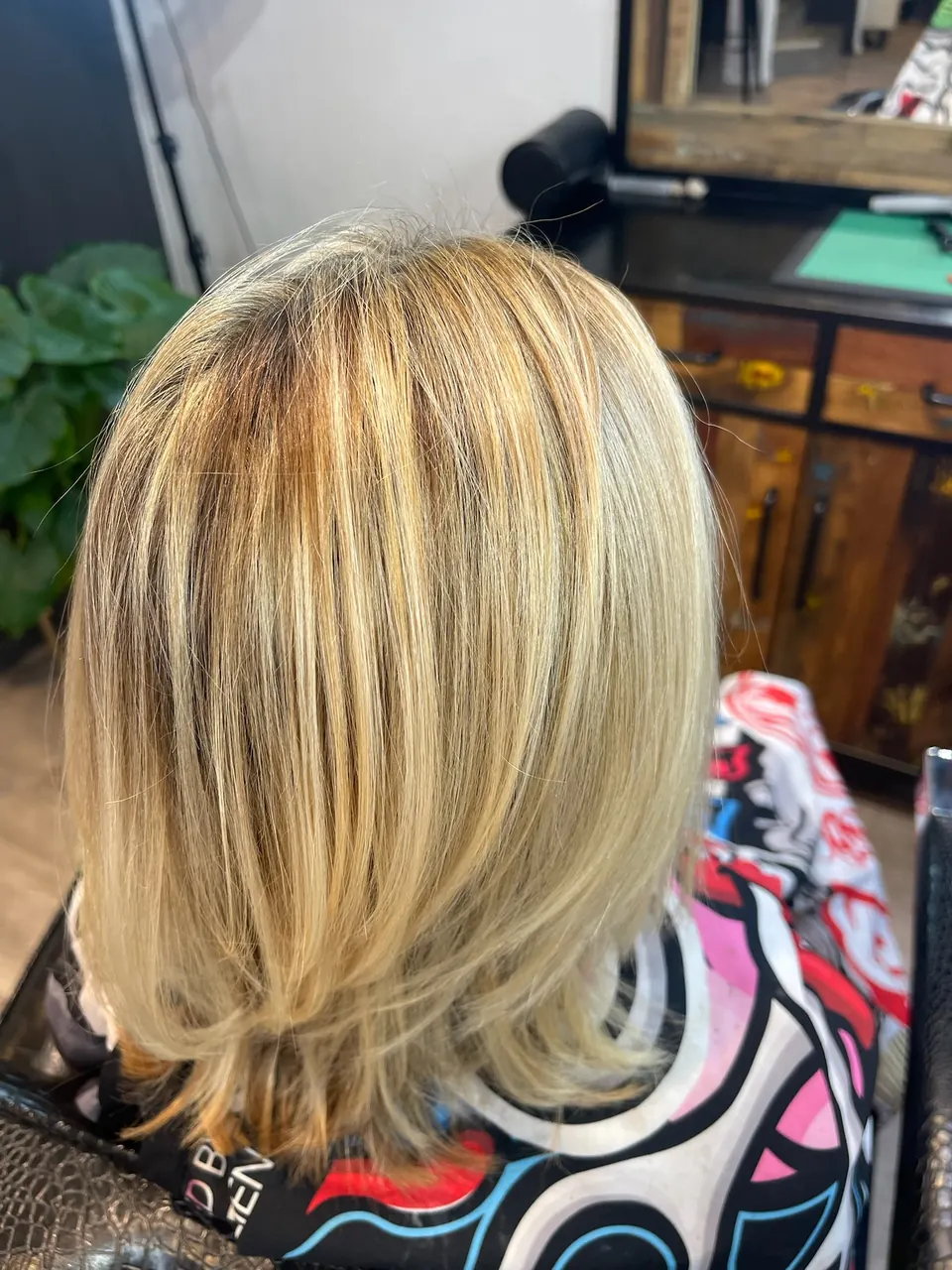 A bright blonde bob, foiled and blown out.