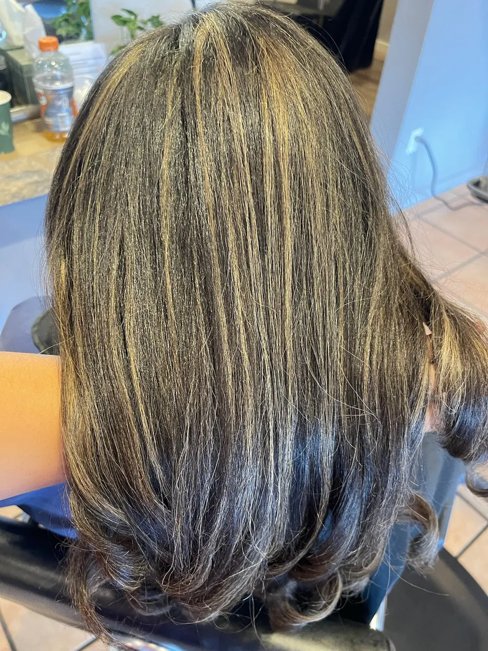 Warm bronde dimension worked through dark hair.