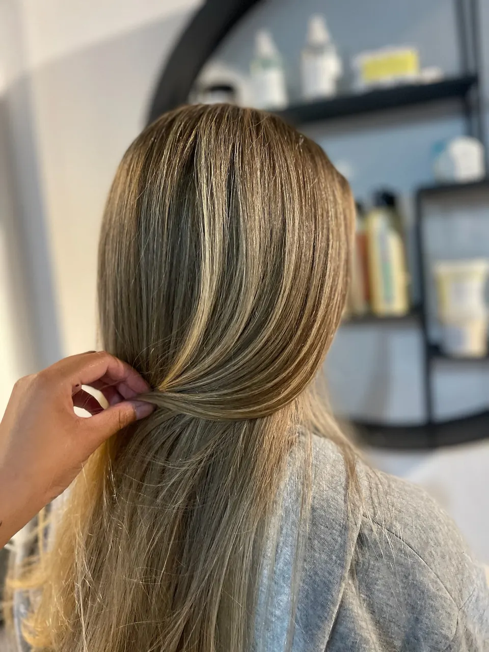 Bronde highlights lifted from underneath to show the blend.