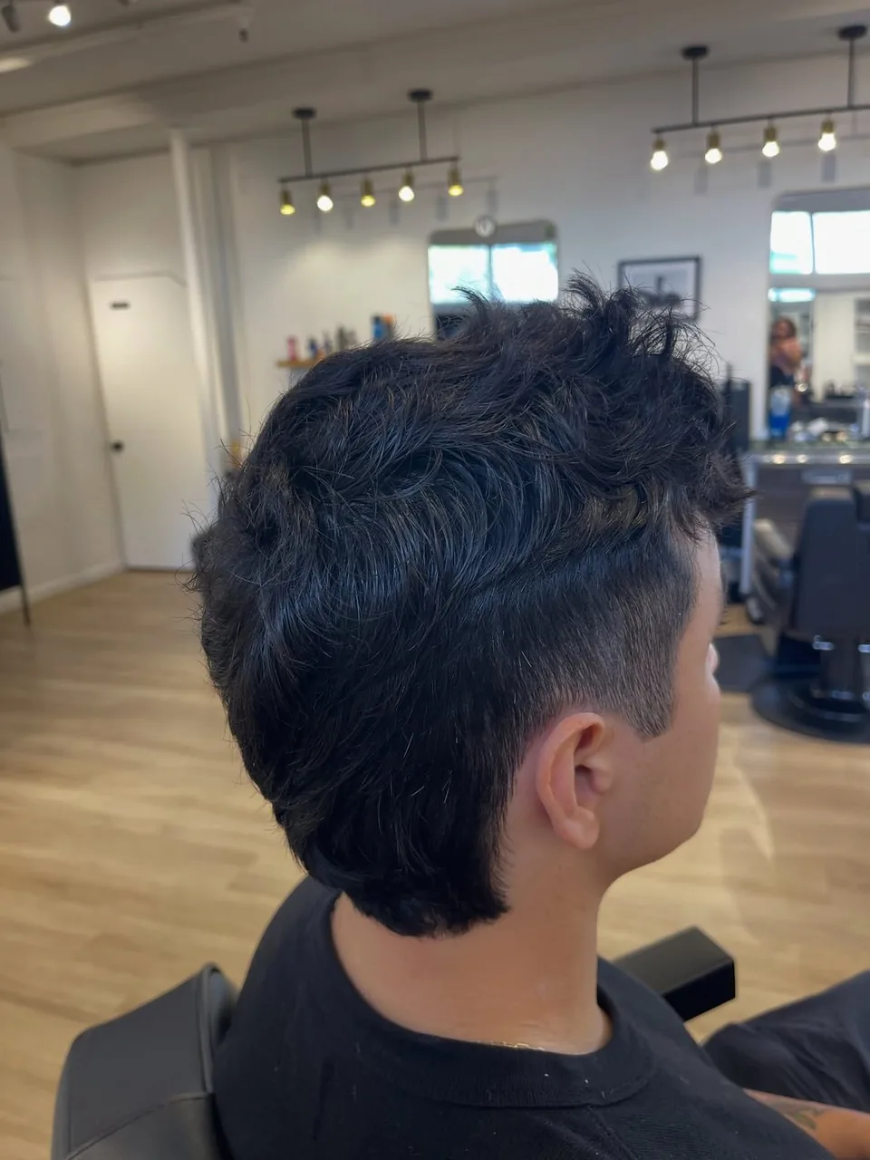A modern mullet with tapered sides and volume through the top.