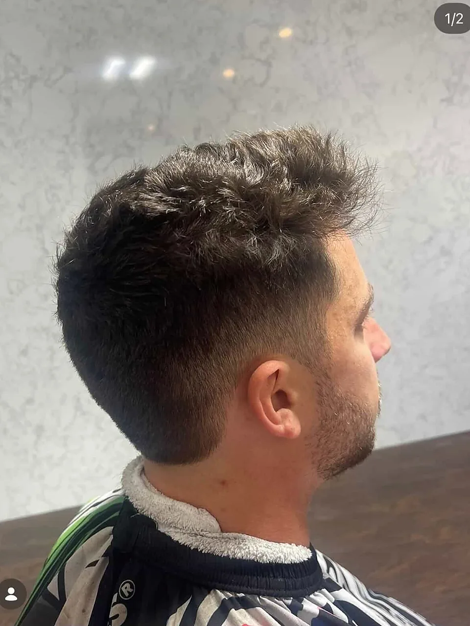 A textured cut, spiky through the top with tight tapered sides.
