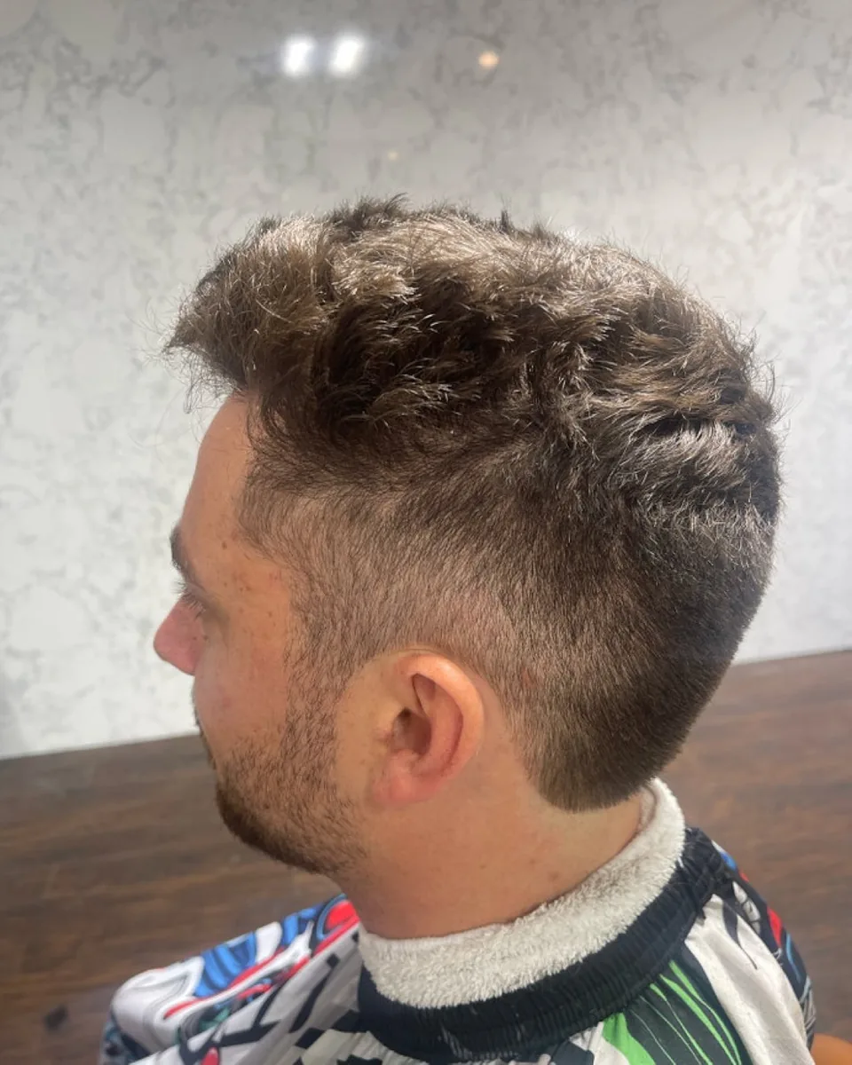 A textured quiff with tapered sides.